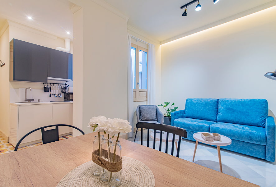 Zona de estar con cocina bierta